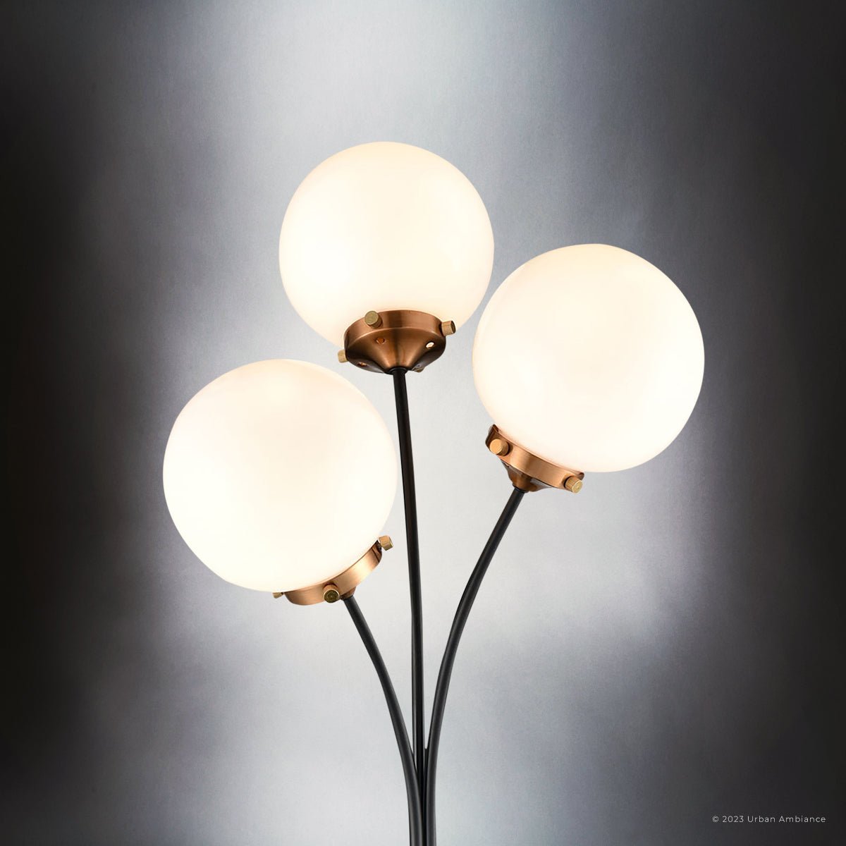 https://www.urbanambiance.com/cdn/shop/products/uex7971-mid-century-modern-floor-lamp-15w-x-15d-x-32h-matte-black-and-aged-brass-finish-leander-collection-151609_1400x.jpg?v=1686433791